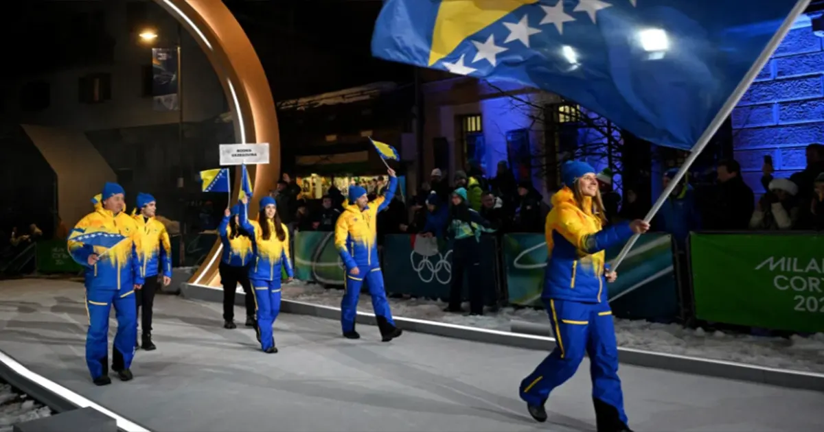Muzaferija sa zastavom BiH u rukama